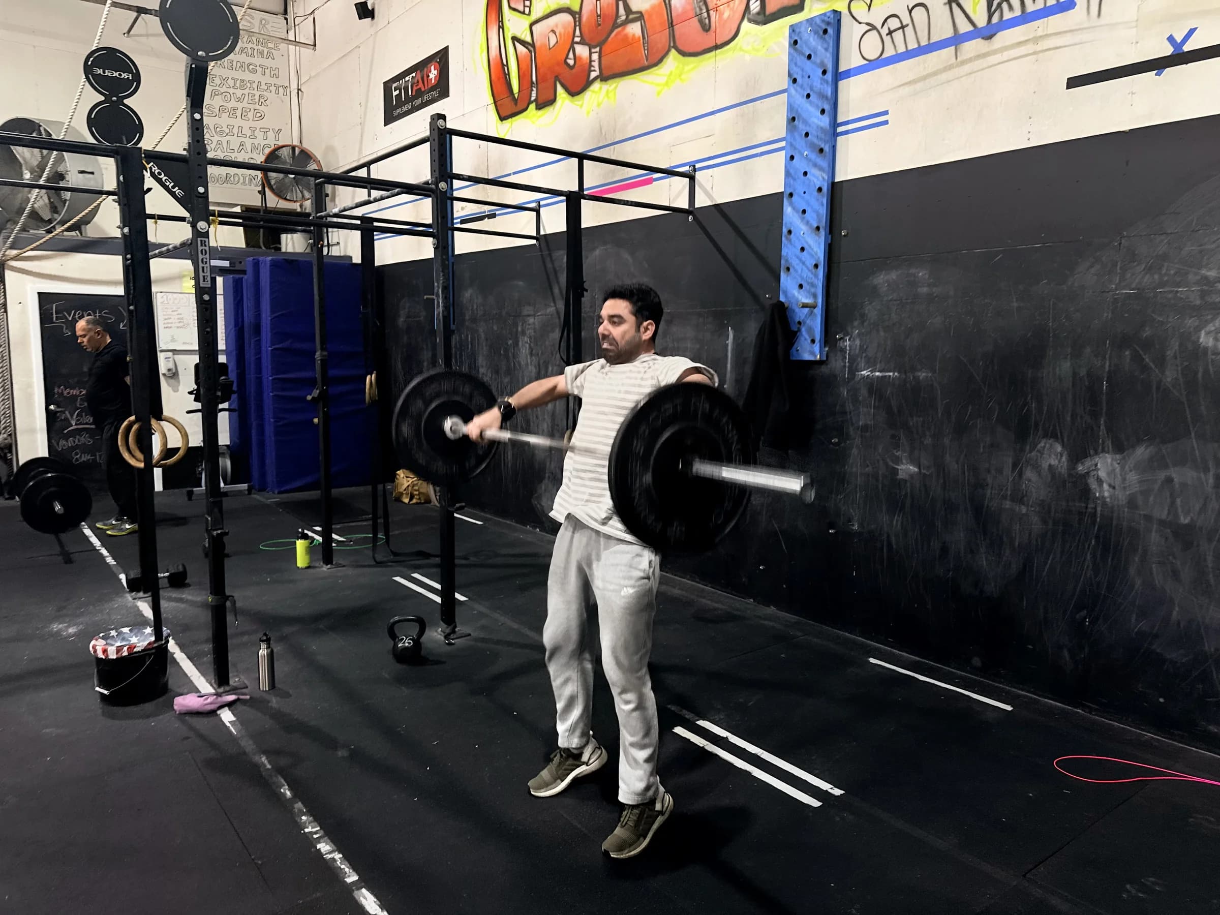 Athlete performing a barbell clean at CrossFit San Ramon